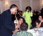 A group of people sitting at tables with musical instruments.